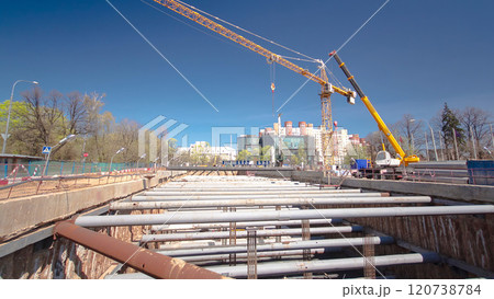 A large huge ditch pit tunnel timelapse hyperlapse at the construction site of the underground metro station line. 120738784