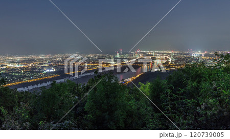 Skyline of Vienna from Danube Viewpoint Leopoldsberg aerial night timelapse. 120739005