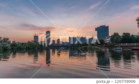 Vienna international center skyscrapers with Kaiserwasser lake reflection view day to night timelapse 120739006