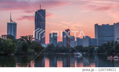 Vienna international center skyscrapers with Kaiserwasser lake reflection view day to night timelapse Vienna international center skyscrapers with Kaiserwasser lake reflection view day to night timelapse 120739011