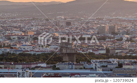 Aerial panoramic view of Vienna city with skyscrapers, historic buildings and a riverside promenade timelapse in Austria. 120739024