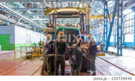 Conveyor assembly stage the body of tractor at big industrial factory timelapse 120739048