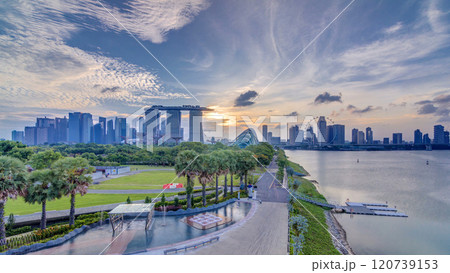 Marina Bay Sands, Gardens by the bay with cloud forest, flower dome and supertrees at sunset timelapse 120739153