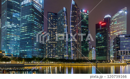 Singapore business district skyscrapers in the night time with water reflections timelapse hyperlapse 120739166
