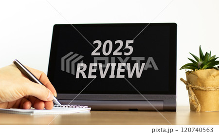 Planning 2025 review new year symbol. Concept words 2025 Review on beautiful black tablet. Beautiful white background. Businessman hand. Business 2025 review new year concept. Copy space. 120740563