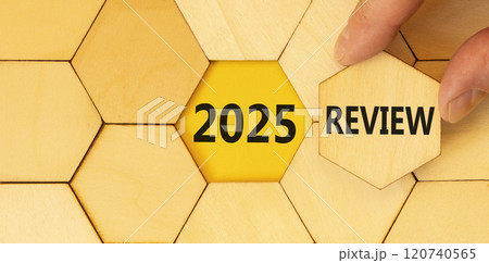Planning 2025 review new year symbol. Concept words 2025 Review on beautiful wooden puzzle. Beautiful wooden background. Businessman hand. Business 2025 review new year concept. Copy space. 120740565