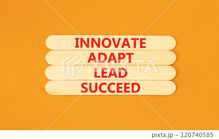 Innovate adapt lead succeed symbol. Concept words Innovate Adapt Lead Succeed on beautiful wooden sticks. Beautiful orange background. Business innovate adapt lead succeed concept. Copy space. Innovate adapt lead succeed symbol. Concept words Innovate Adapt Lead Succeed on beautiful wooden sticks. Beautiful orange background. Business innovate adapt lead succeed concept. Copy space. 120740585