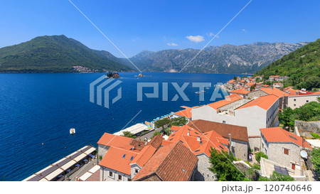 Stunning coastal view of historic village by the Kotor bay on a clear sunny day Stunning coastal view of historic village by the Kotor bay on a clear sunny day 120740646