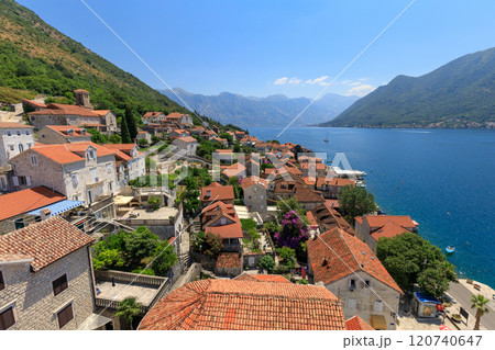 Stunning coastal view of historic village by the Kotor bay on a clear sunny day Stunning coastal view of historic village by the Kotor bay on a clear sunny day 120740647