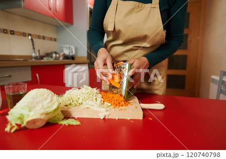 Preparing fresh vegetables in a cozy kitchen setting 120740798