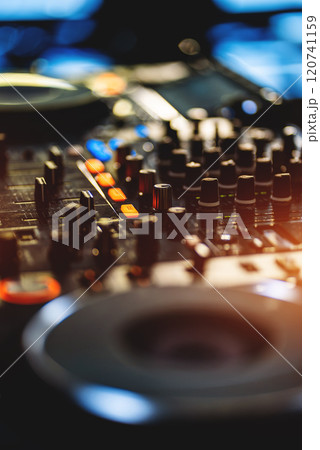 closeup of professional digital pioneer dj decks and audio mixer equipment ready for party in nightclub 120741159