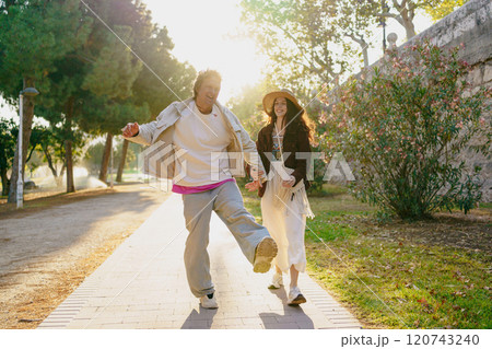 A Joyful Couple Walking Together in Beautiful Nature, Embracing Their Bonding Adventure A Joyful Couple Walking Together in Beautiful Nature, Embracing Their Bonding Adventure 120743240