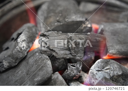 Burning charcoal in a brazier, closeup of photo Burning charcoal in a brazier, closeup of photo 120746721