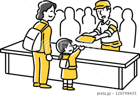 子供に記念品を渡す男性職員 120749435