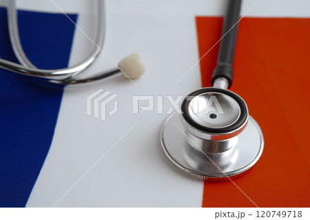 France flag with black stethoscope, Business and finance concept. France flag with black stethoscope, Business and finance concept. 120749718