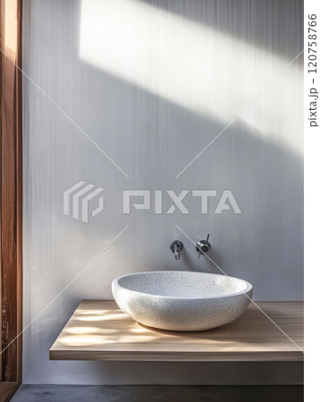 Modern bathroom with a unique stone basin and natural lighting in a serene setting Modern bathroom with a unique stone basin and natural lighting in a serene setting 120758766