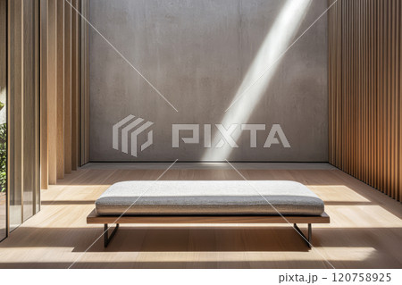 Minimalist interior space with wooden bench and natural light streaming in 120758925