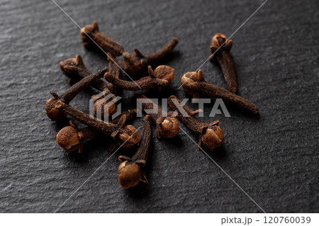 Whole cloves spice over black background. 120760039