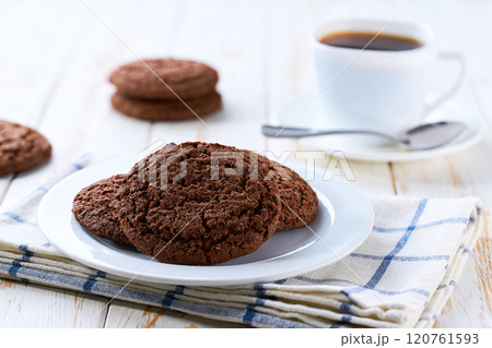 American chocolate cookies and coffee on a light kitchen table, selective focus. 120761593