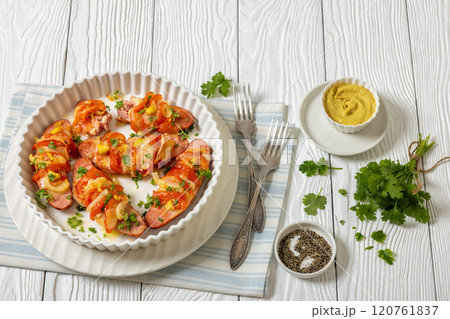 hot sausages baked with cheese, tomato, mustard hot sausages baked with cheese, tomato, mustard 120761837