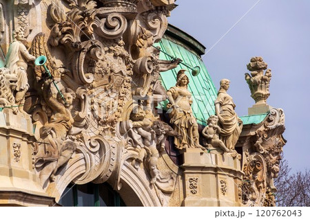 Detail of beautiful statues on the Wallpavillon Zwinger palace, Dresden, Germany, sunny day clear blue sky background 120762043