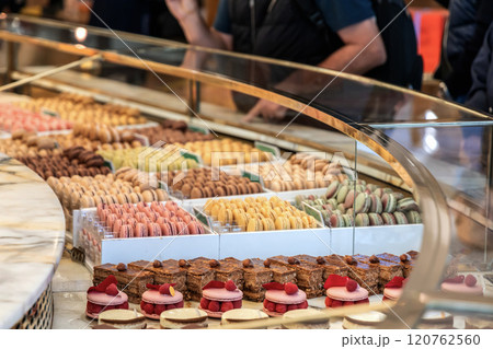 Various assortment of desserts confectionery on the counter in a bakery 120762560
