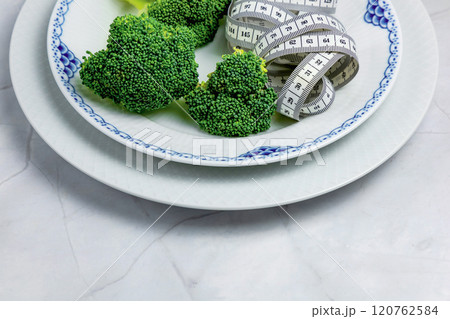 Concept of healthy eating and weight loss. Plate of broccoli. Concept of healthy eating and weight loss. Plate of broccoli. 120762584