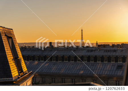 View of Paris and Eiffel Tower and rooftops from above. Beautiful sunset over Paris, France 120762633
