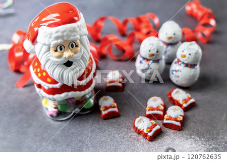 Christmas chocolates. Chocolate Christmas trees and Santa Claus. 120762635