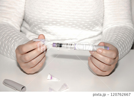 Female hands holding an insulin pen. Ozempic Insulin injection pen. 120762667