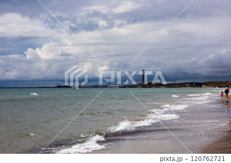 Dramatic seascape in dark colors. Dark sky with clouds over the stormy sea. 120762721
