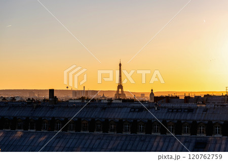 View of Paris and Eiffel Tower and rooftops from above. Beautiful sunset over Paris, France 120762759