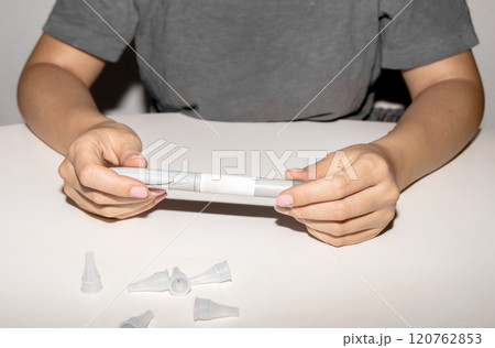 Female hands holding an insulin pen. Ozempic Insulin injection pen. 120762853