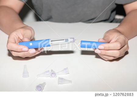 Female hands holding an insulin pen. Ozempic Insulin injection pen. 120762883