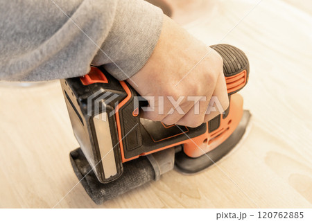 Work with a grinder on wood. Work tool. 120762885
