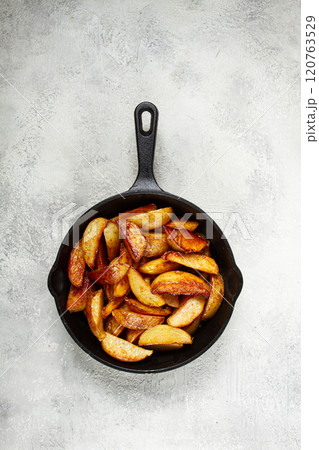 fried potato slices, in a cast-iron pan, homemade, no people, fried potato slices, in a cast-iron pan, homemade, no people, 120763529