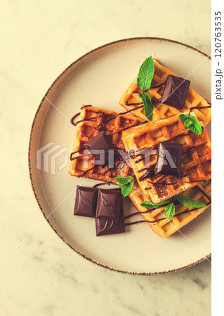 Viennese waffles, with chocolate, breakfast, on a beige background, no people, selective focus, Viennese waffles, with chocolate, breakfast, on a beige background, no people, selective focus, 120763535