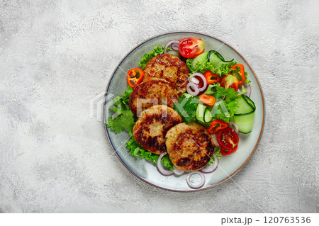 fried chicken cutlets, minced chicken, with vegetables, on gray , with vegetable salad, top view, homemade, no people, fried chicken cutlets, minced chicken, with vegetables, on gray , with vegetable salad, top view, homemade, no people, 120763536