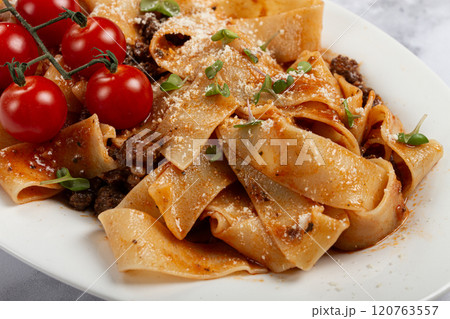pappardelle pasta with bolognese sauce, topped with parmesan cheese and cherry branch, homemade, no people, pappardelle pasta with bolognese sauce, topped with parmesan cheese and cherry branch, homemade, no people, 120763557