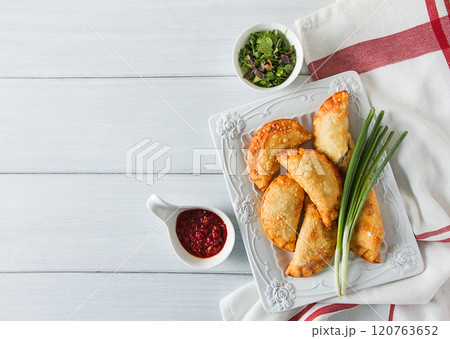 Fried chebureks, close-up, on a light background, no people, Fried chebureks, close-up, on a light background, no people, 120763652