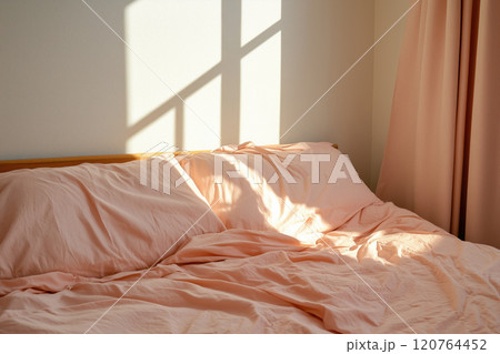 pink blanket on bed with sunlight from window in morning, bedroom interior 120764452