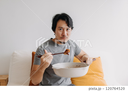 Man eating his homemade diet meal in the pan as it is his daily routine. Man eating his homemade diet meal in the pan as it is his daily routine. 120764520