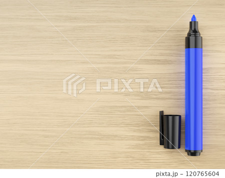 Blue permanent marker on wooden desk 120765604