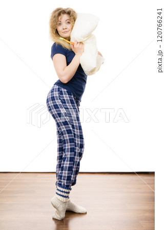 Happy cheerful woman wearing pajamas Happy cheerful woman wearing pajamas 120766241