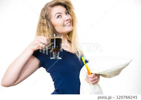 Happy woman holding toothbrush and coffee Happy woman holding toothbrush and coffee 120766245