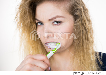 Woman brushing cleaning teeth Woman brushing cleaning teeth 120766252