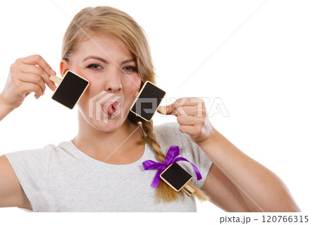Teenage girl holding little school blackboards 120766315