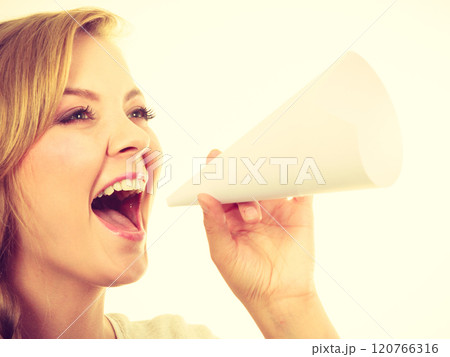 Woman screaming through megaphone made of paper 120766316