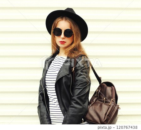 Portrait pretty young woman in fashion black rock style posing over white background Portrait pretty young woman in fashion black rock style posing over white background 120767438