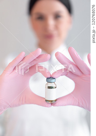 Anonymous female dermatologist holding medicine Anonymous female dermatologist holding medicine 120768076